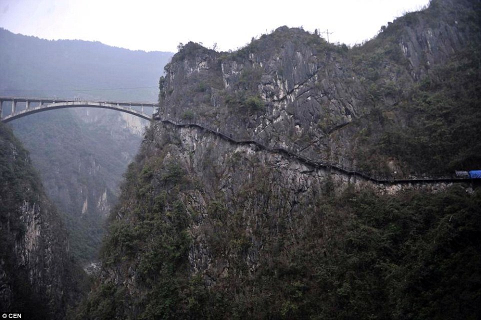 A cliff-side walkway which stretches across the previously inaccessible Wuling mountain range in south west China is to be opened 